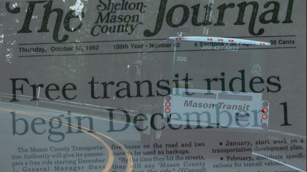 An MTA bus juxtaposed with an article from The Journal announcing MTA's first day of service and being fare-free.